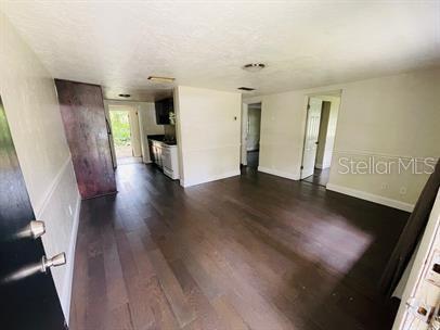 2202 Southeast 46 Terrace Gainesville, FL 32641 - Photo 2 of 10 a view of a hallway with wooden floor