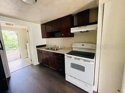 a kitchen with a stove and a microwave