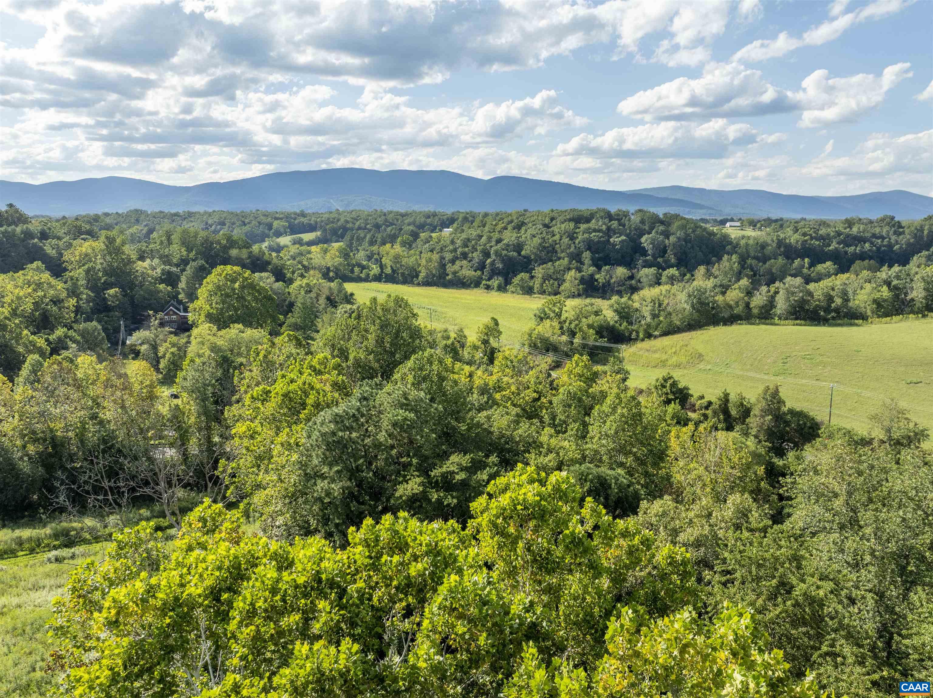 Lot 5 Gillums Ridge Road Charlottesville, VA 22903 - Photo 12 of 14 a view of a city with lush green forest