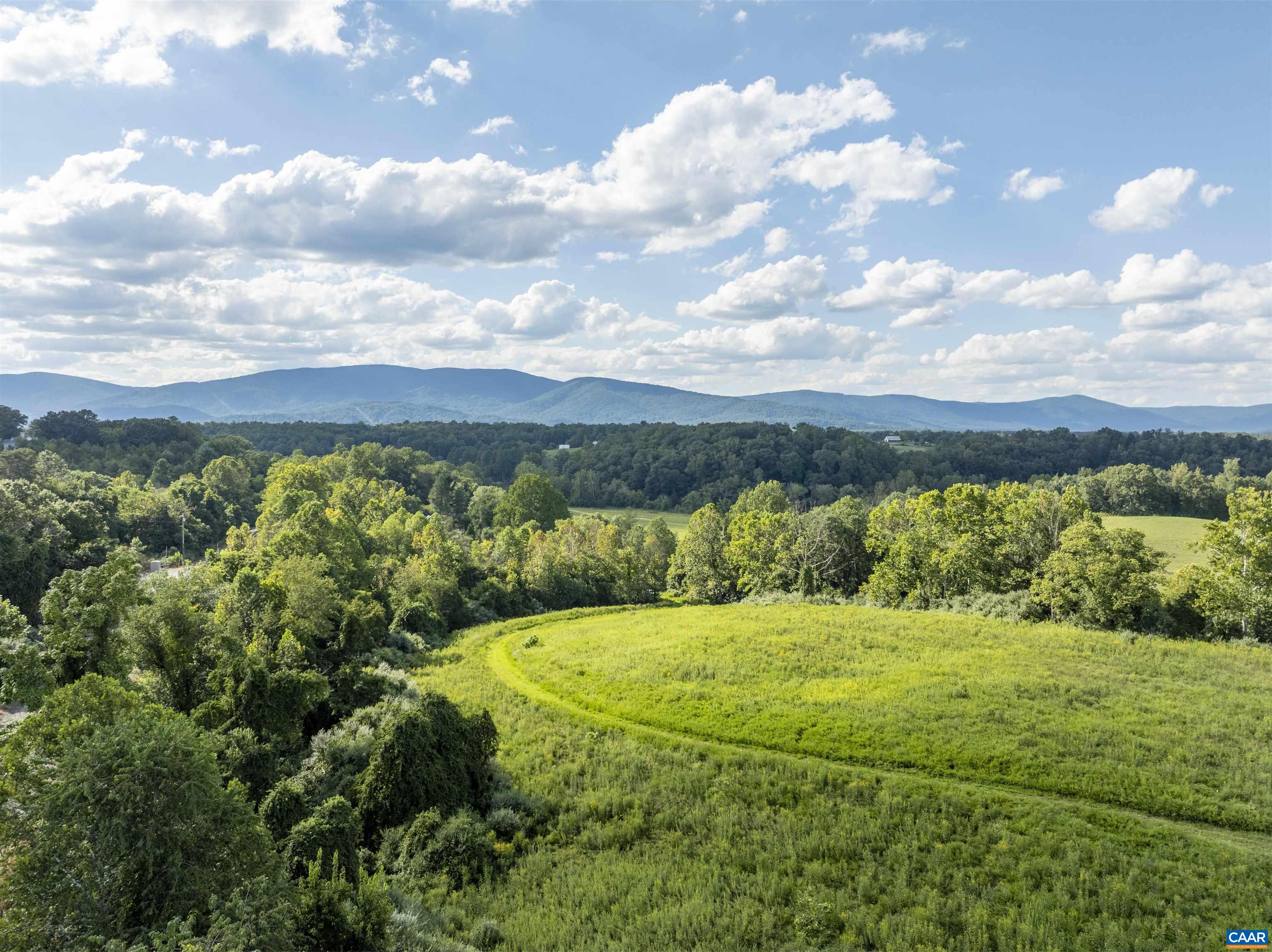 Lot 5 Gillums Ridge Road Charlottesville, VA 22903 - Photo 6 of 14 a view of a lake with a yard