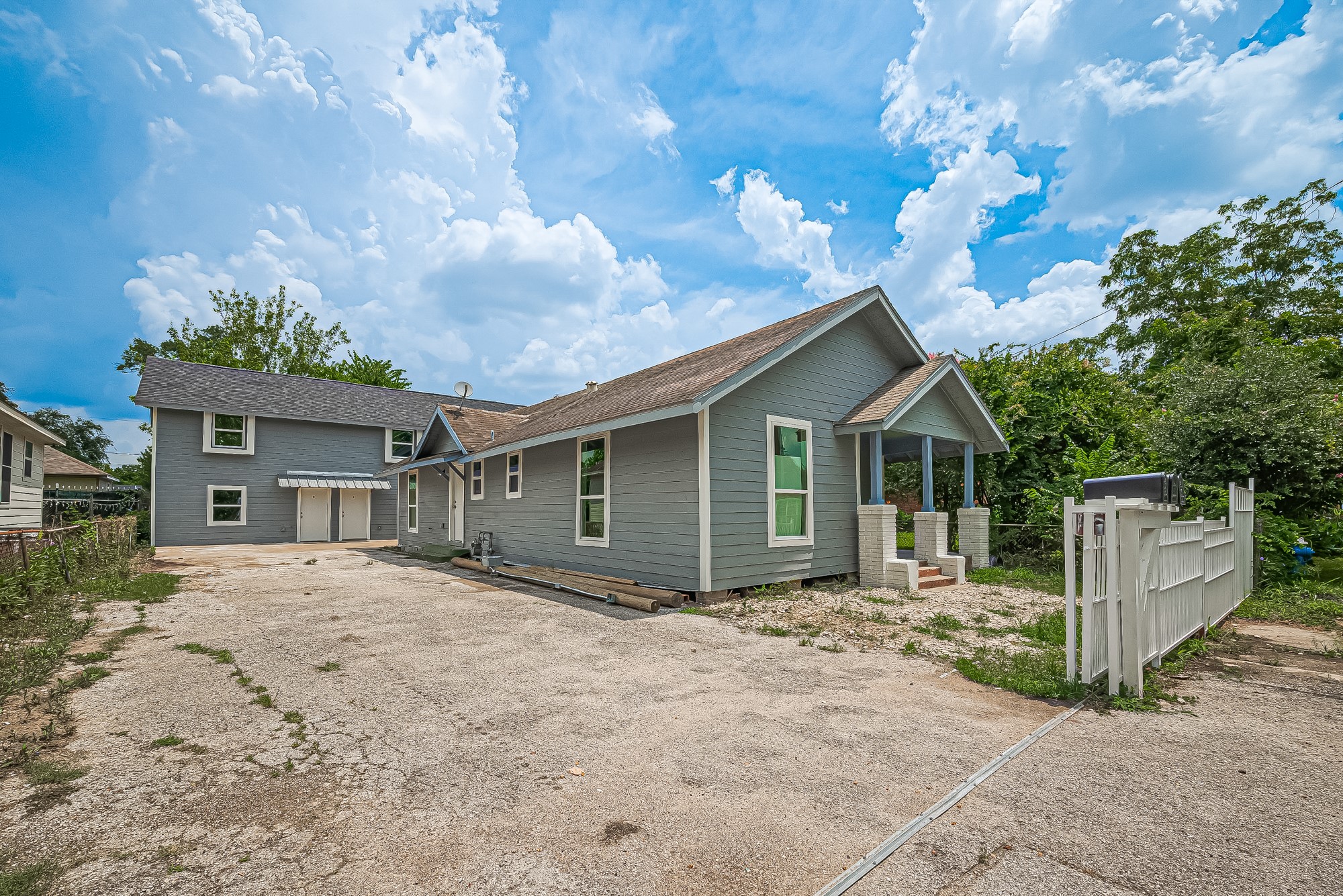 4013 Ranch Street, Unit 1 Houston, TX 77026 - Photo 16 of 16 a front view of a house with a yard and garage