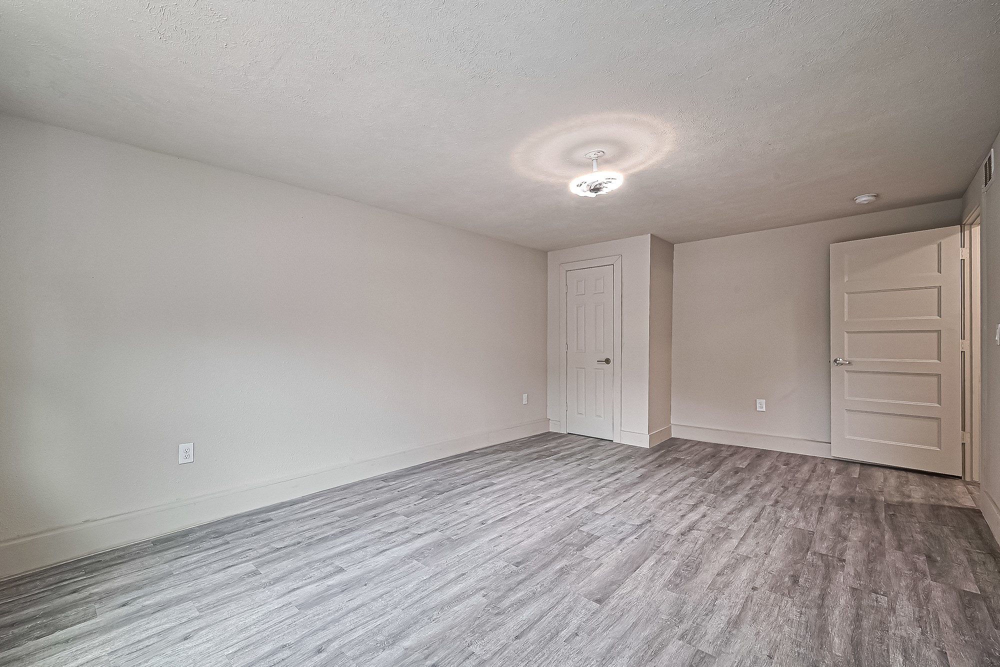 4013 Ranch Street, Unit 1 Houston, TX 77026 - Photo 6 of 16 a view of an empty room with wooden floor