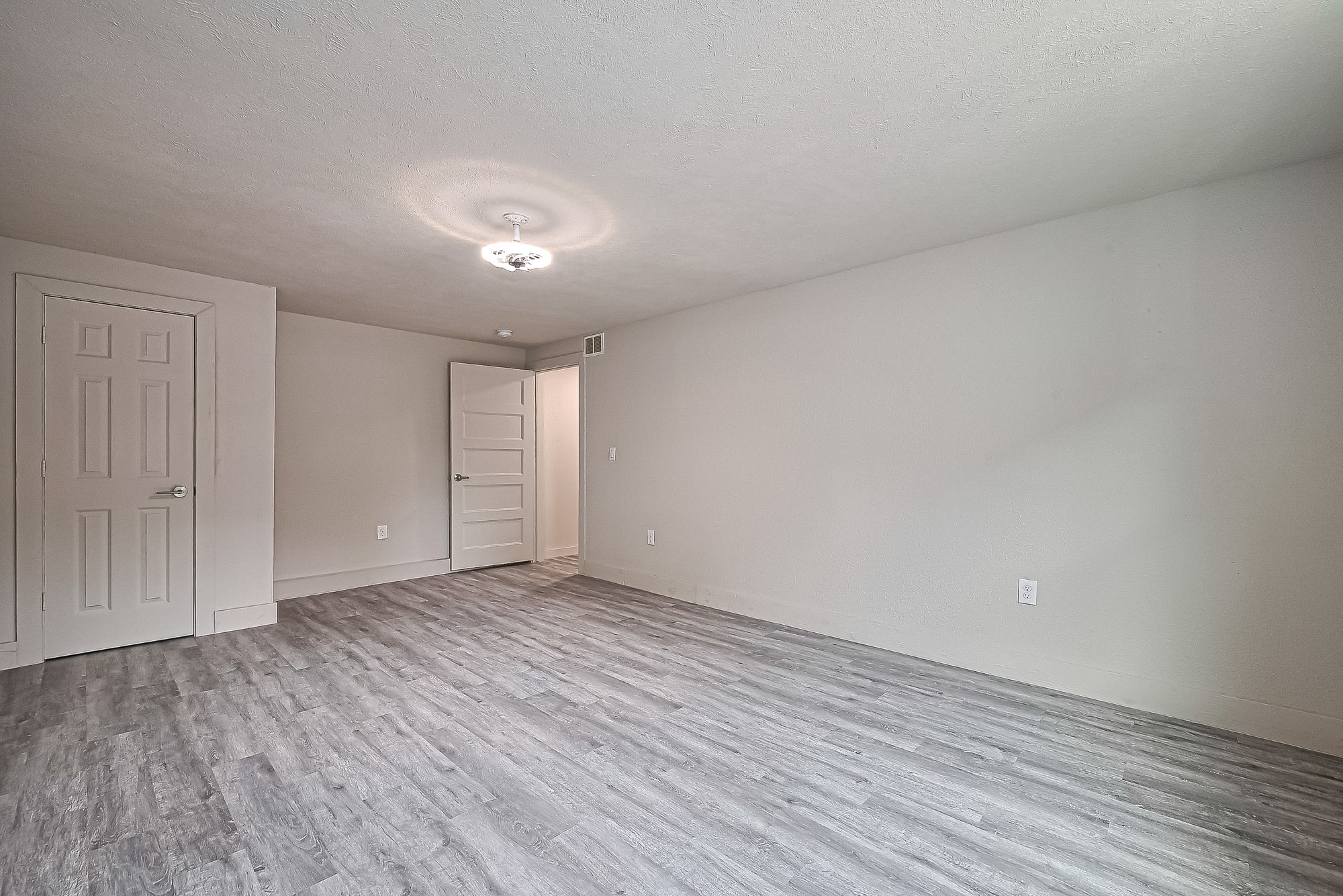 4013 Ranch Street, Unit 1 Houston, TX 77026 - Photo 7 of 16 a view of an empty room with wooden floor