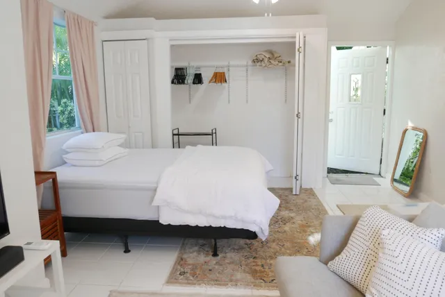 a kitchen with white cabinets stainless steel appliances and sink