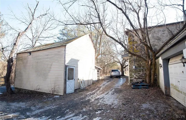 a view of a yard covered in snow