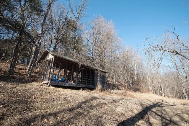 a view of a house with snow in front of house