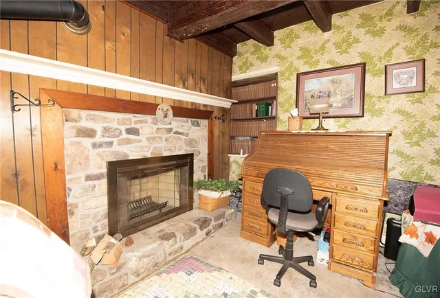 a living room with furniture and a fireplace