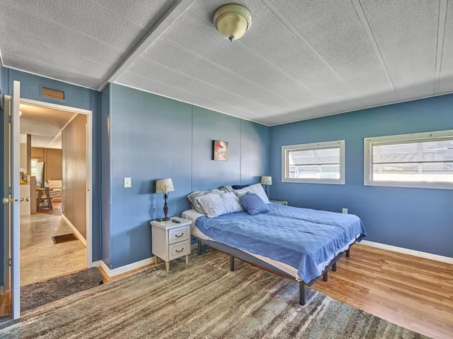 a white toilet sitting next to a shower curtain