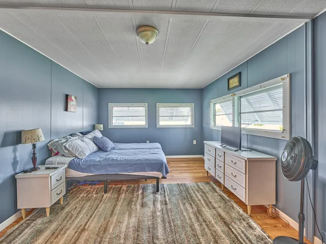 a bathroom with a toilet and a shower curtain