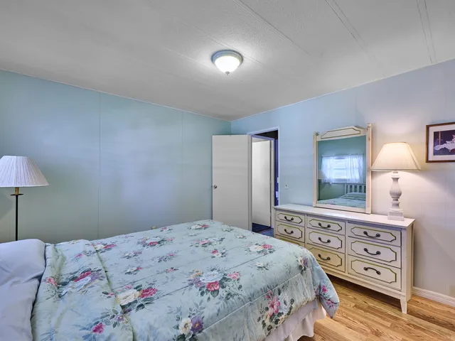 a bathroom with a sink a toilet and shower curtain