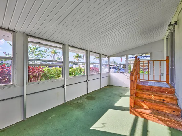 a front view of a house with a yard and a garage