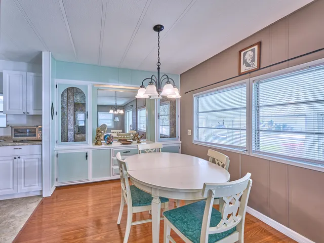 a kitchen with sink and cabinets