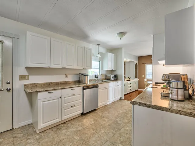 a bedroom with a bed and a chair