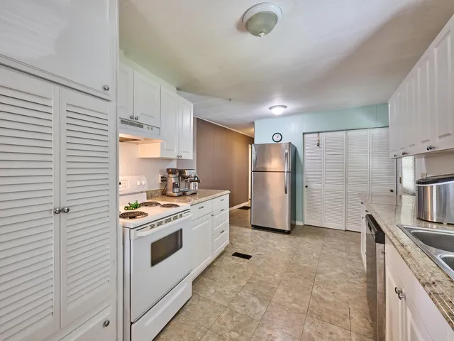 a bedroom with a bed and dresser