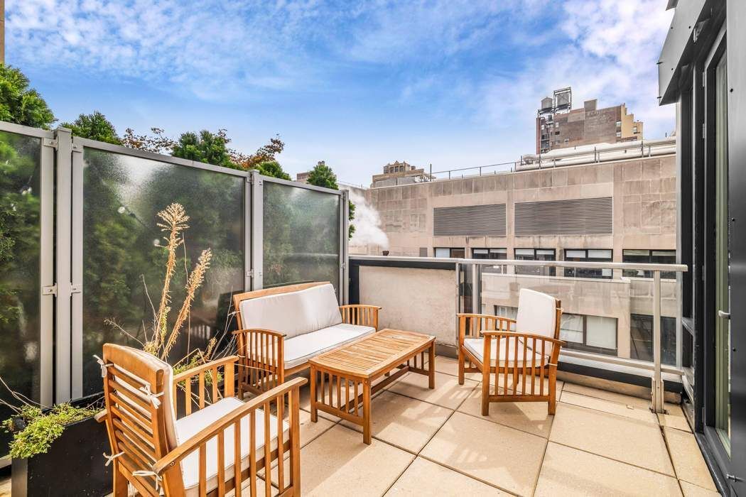 261 West 28th Street, Unit 9C Manhattan, NY 10001 - Photo 3 of 12 a terrace with outdoor seating and city view