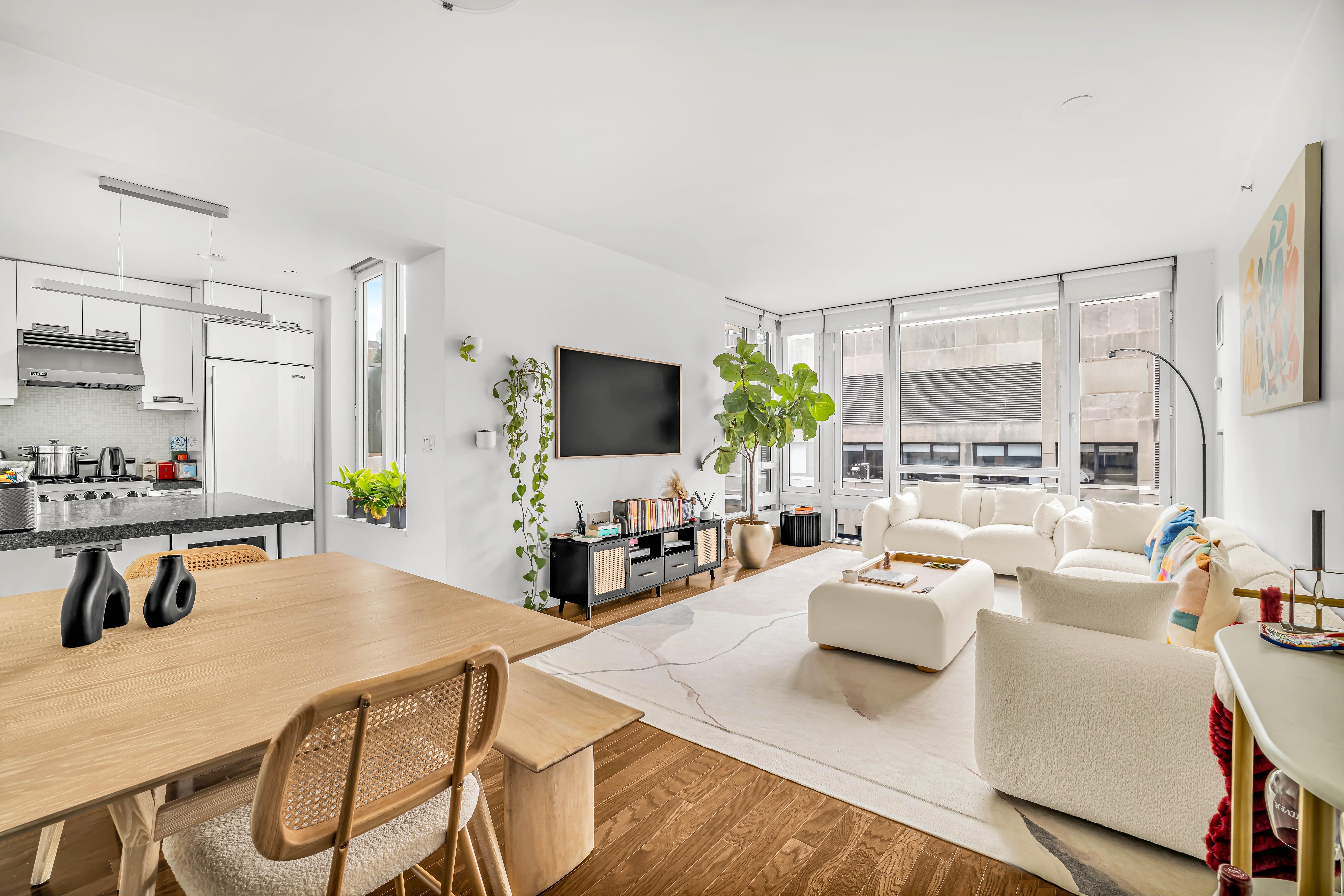 261 West 28th Street, Unit 9C Manhattan, NY 10001 - Photo 4 of 12 a living room with fireplace furniture and a flat screen tv