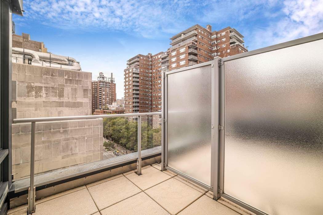 261 West 28th Street, Unit 9C Manhattan, NY 10001 - Photo 8 of 12 a view of a glass door with glass windows