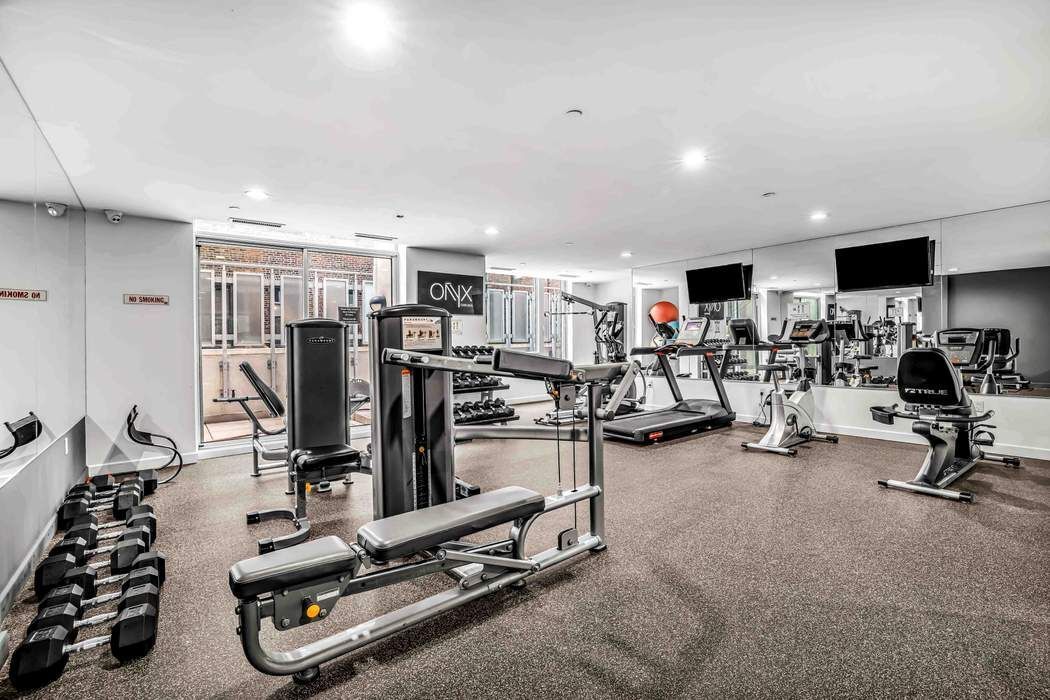 261 West 28th Street, Unit 9C Manhattan, NY 10001 - Photo 9 of 12 a view of a room with gym equipment