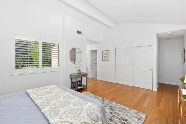 a bed room with a bed and a table