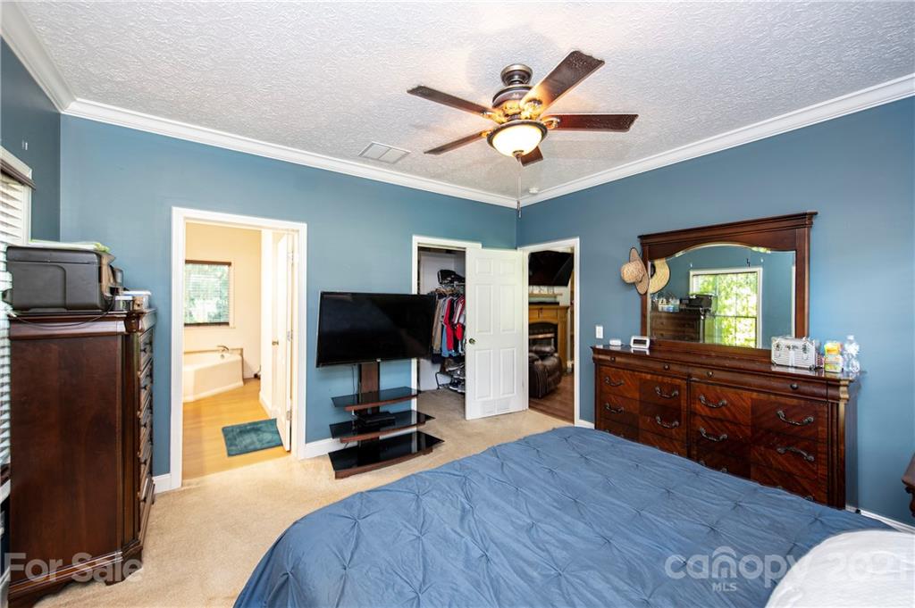 1916 Hardin Strait Road Chester, SC 29706 - Photo 22 of 32 a bedroom with a bed and a flat screen tv