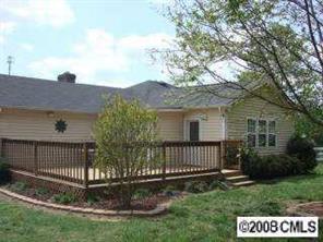 5532 Randolph Road Kannapolis, NC 28081 - Photo 3 of 3 a view of a house with a yard and fence