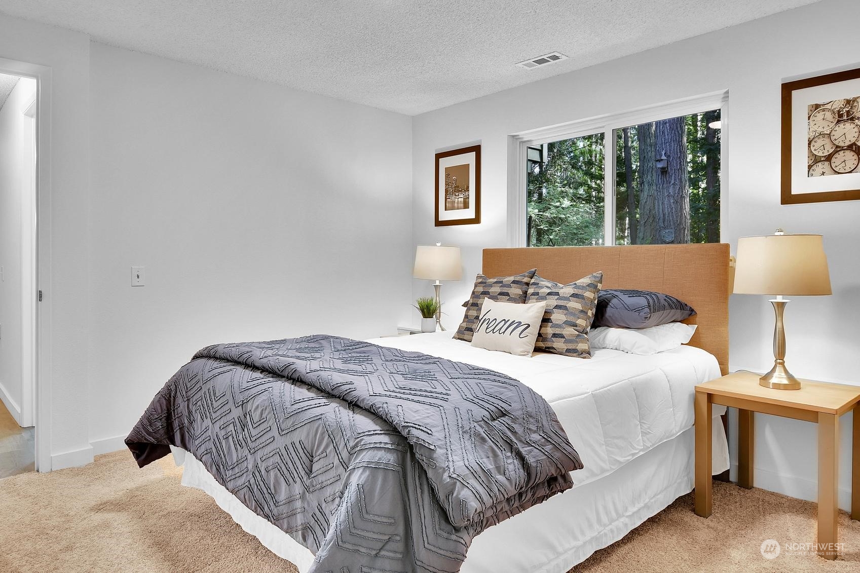 318 170th Place Southwest Bothell, WA 98012 - Photo 26 of 34 a bedroom with a large bed and a lamp