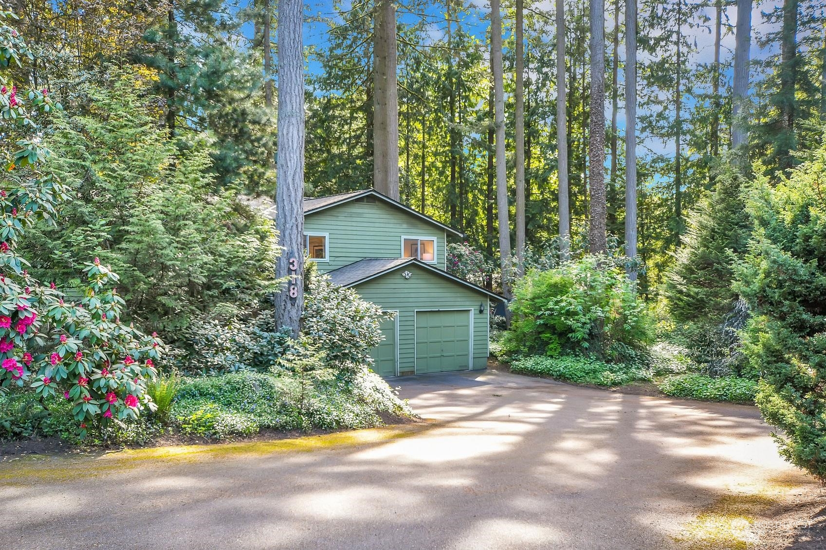 318 170th Place Southwest Bothell, WA 98012 - Photo 29 of 34 a view of a house with a yard and garden
