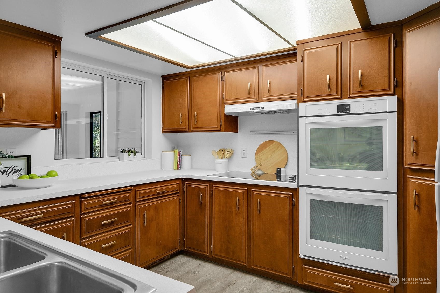 318 170th Place Southwest Bothell, WA 98012 - Photo 10 of 34 a kitchen with stainless steel appliances granite countertop a sink and cabinets with granite countertops