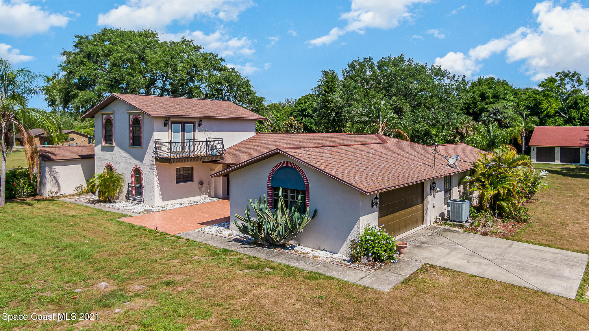3330 Grant Line Road Mims, FL 32754 - Photo 3 of 42 a front view of a house with garden