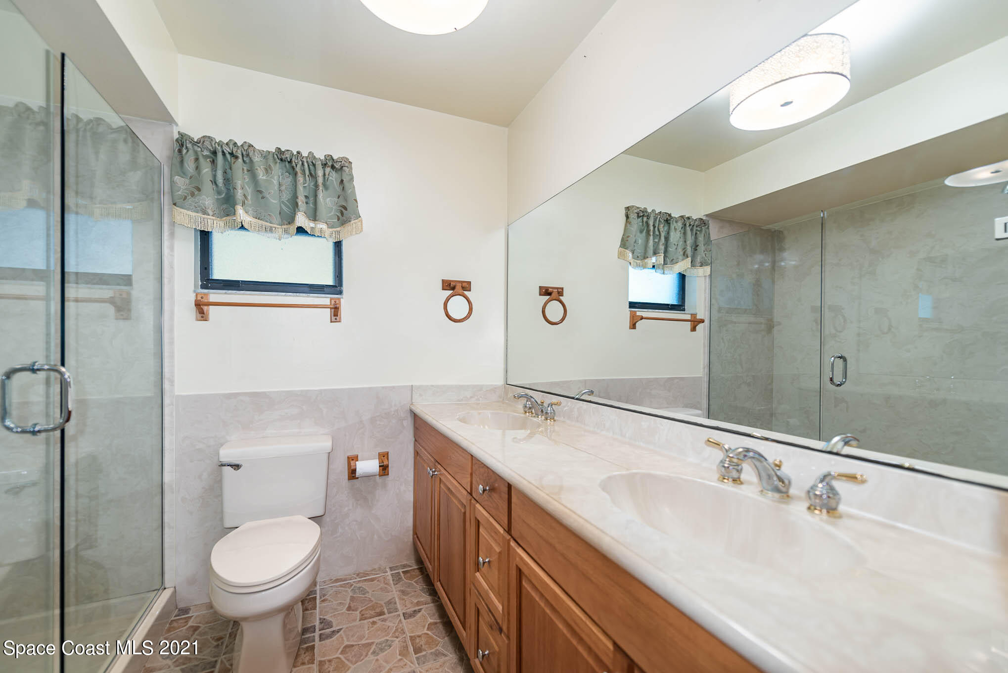 3330 Grant Line Road Mims, FL 32754 - Photo 22 of 42 a bathroom with a sink toilet and shower