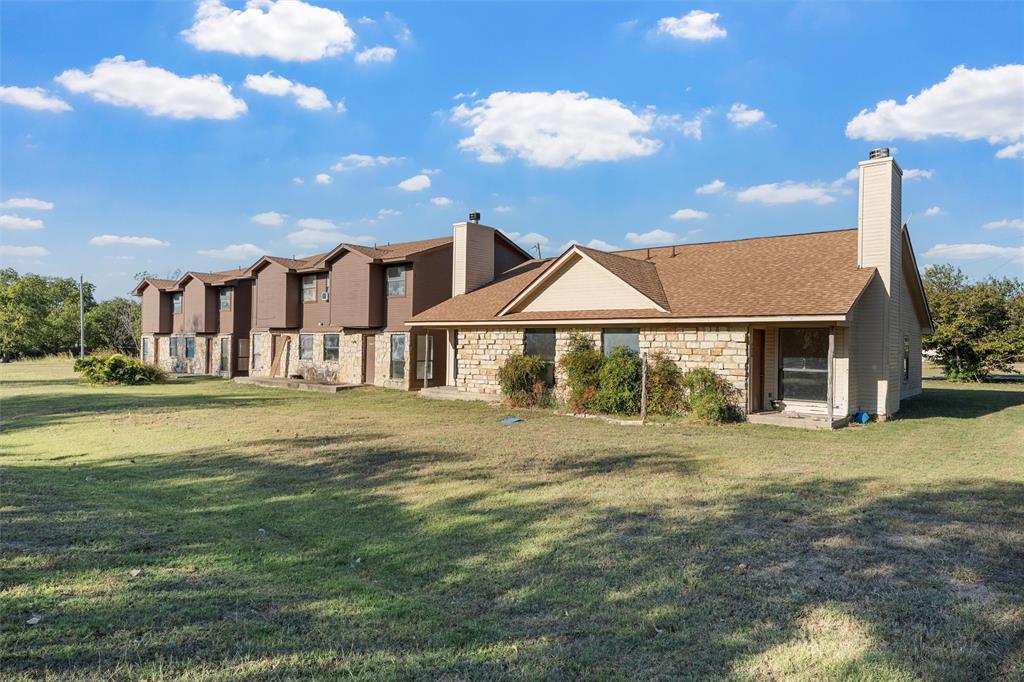 909 Shepherd Street Morgan, TX 76671 - Photo 3 of 5 a view of a house with a yard