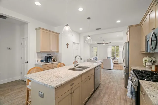 a dining room with wooden floor and a window