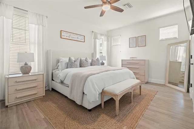 a bedroom with a bed and a window