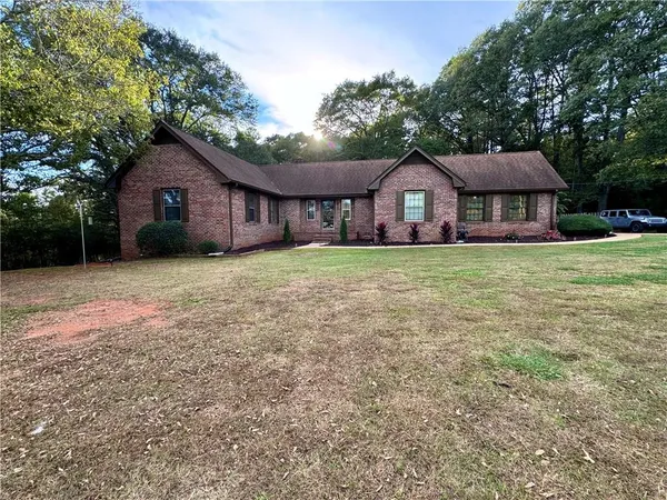 a house with huge green field in front of it