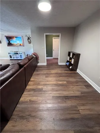 a kitchen with stainless steel appliances a refrigerator a sink a stove and cabinets