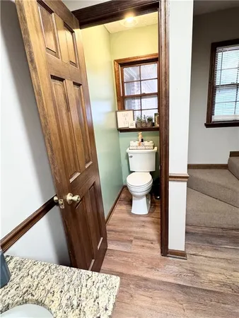a view of a sink and mirror in a kitchen