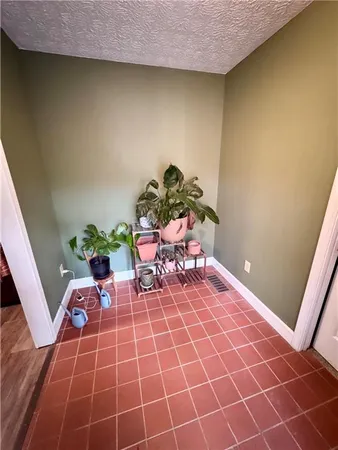 a view of a livingroom with furniture and staircase