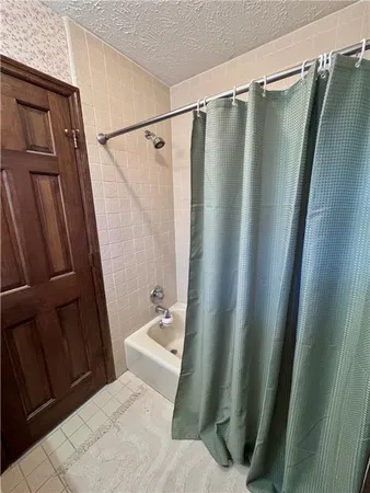 a bedroom with bed and window