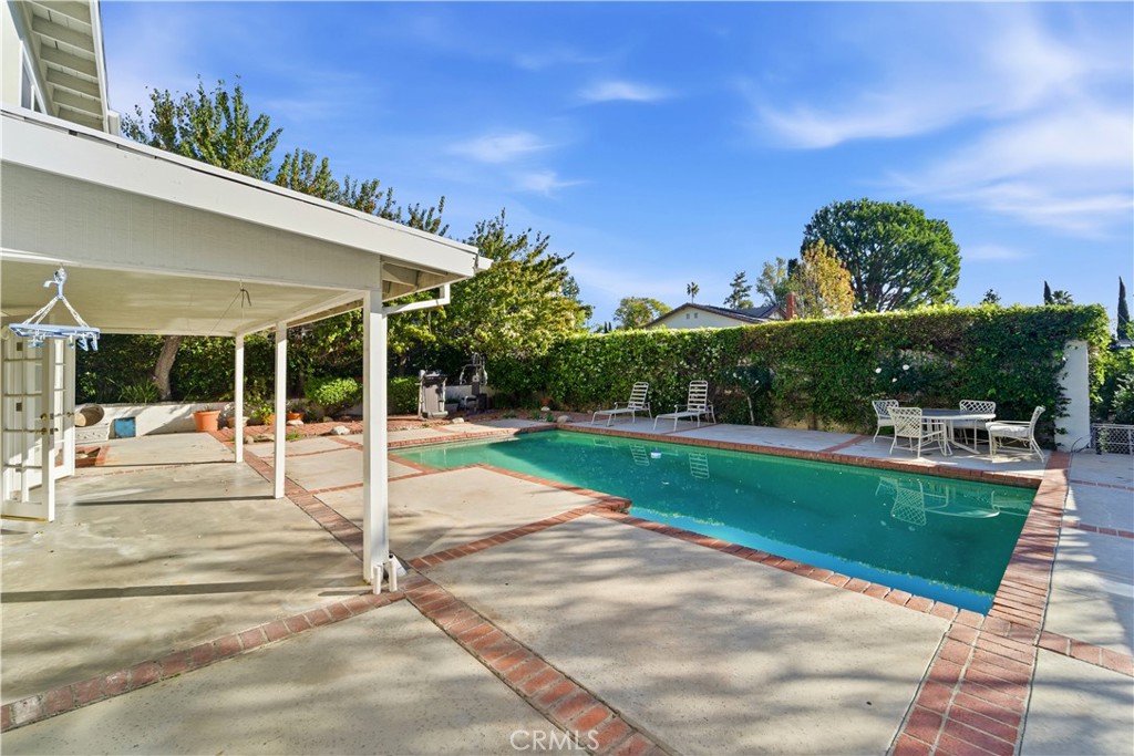 a view of a patio with a backyard