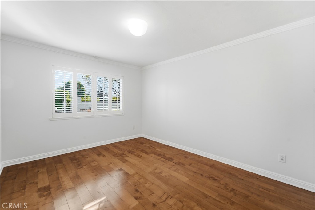 11344 Baird Avenue Porter Ranch, CA 91326 - Photo 14 of 45 wooden floor in an empty room with a window