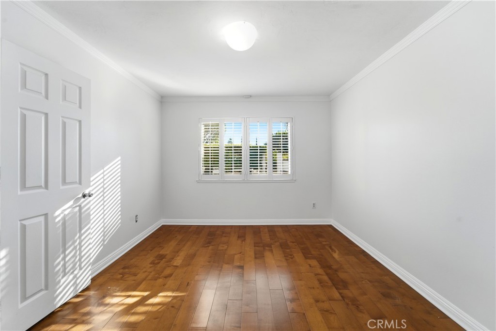 11344 Baird Avenue Porter Ranch, CA 91326 - Photo 15 of 45 a view of empty room with wooden floor and fan