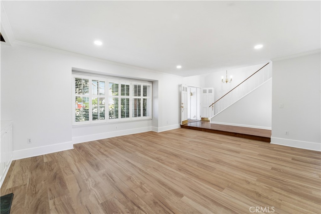 11344 Baird Avenue Porter Ranch, CA 91326 - Photo 17 of 45 an empty room with wooden floor and windows