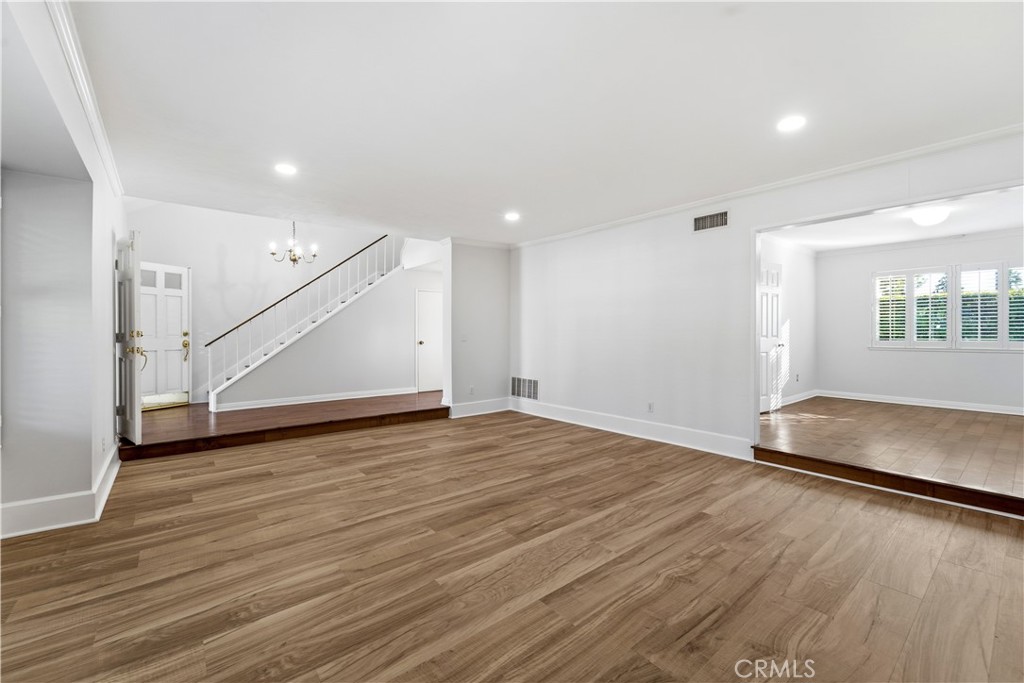 11344 Baird Avenue Porter Ranch, CA 91326 - Photo 18 of 45 an empty room with wooden floor and windows