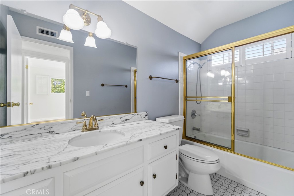 11344 Baird Avenue Porter Ranch, CA 91326 - Photo 26 of 45 a bathroom with a double vanity sink toilet and shower