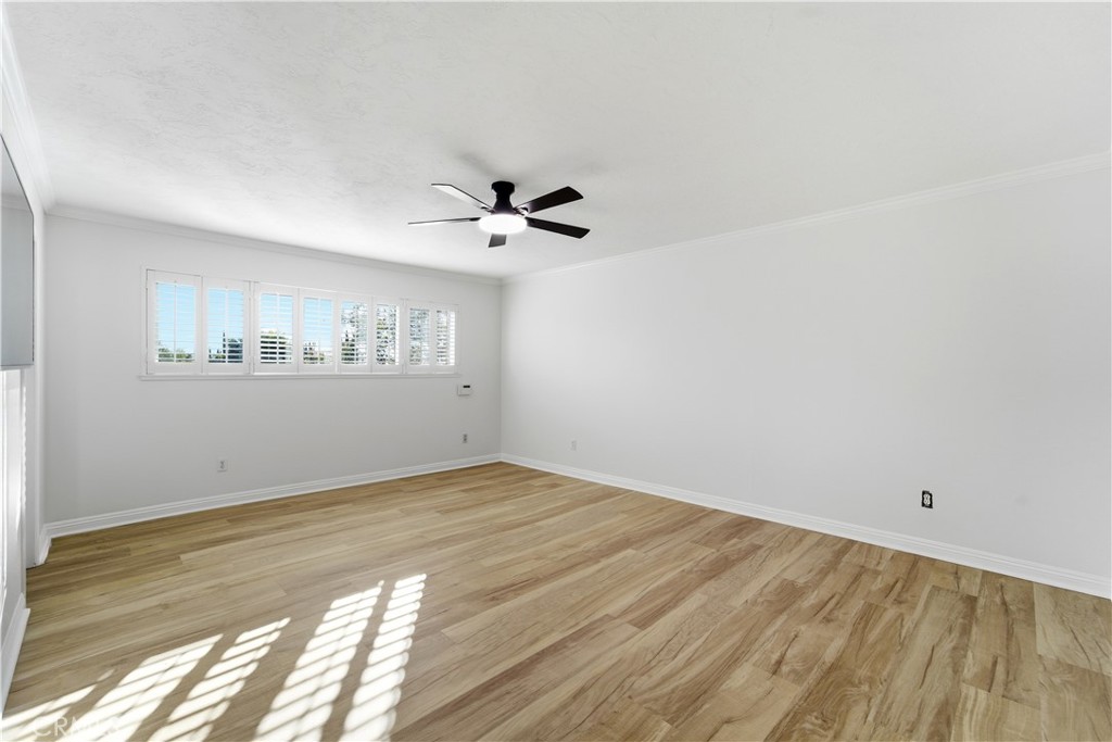 11344 Baird Avenue Porter Ranch, CA 91326 - Photo 31 of 45 a view of empty room with wooden floor and fan