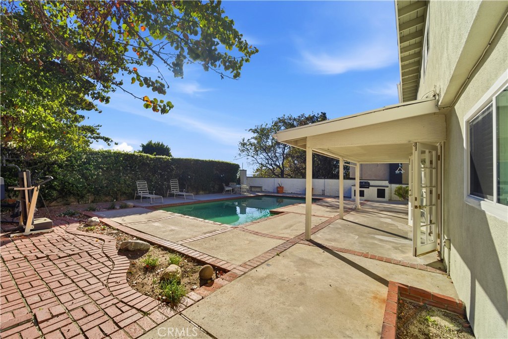 11344 Baird Avenue Porter Ranch, CA 91326 - Photo 37 of 45 a view of a patio with table and chairs with wooden floor and fence