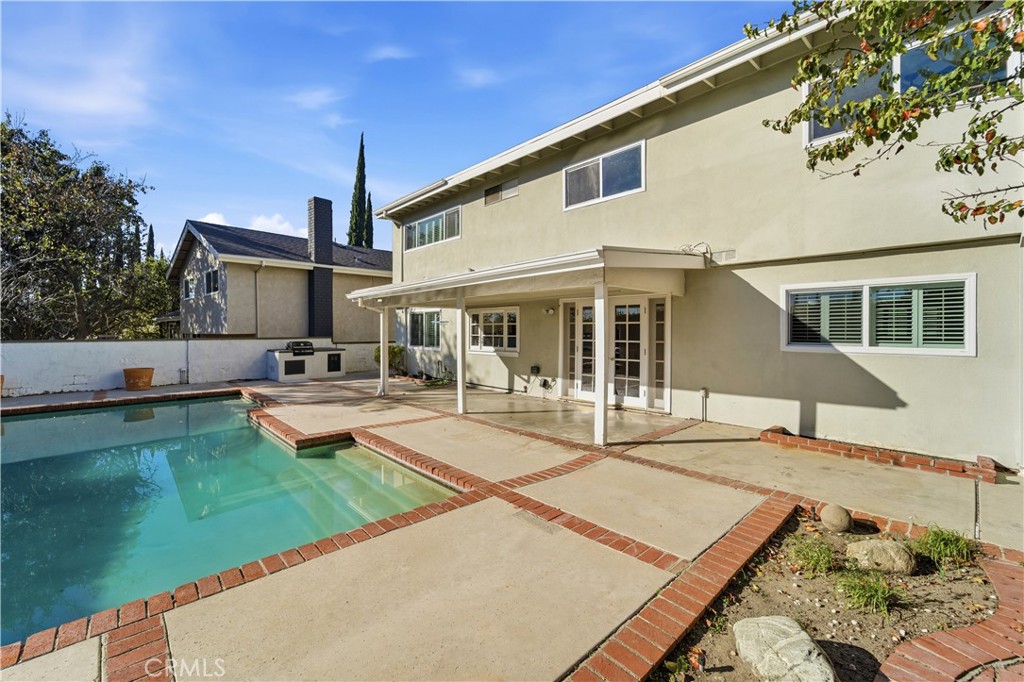 11344 Baird Avenue Porter Ranch, CA 91326 - Photo 38 of 45 a view of a house with swimming pool and sitting area