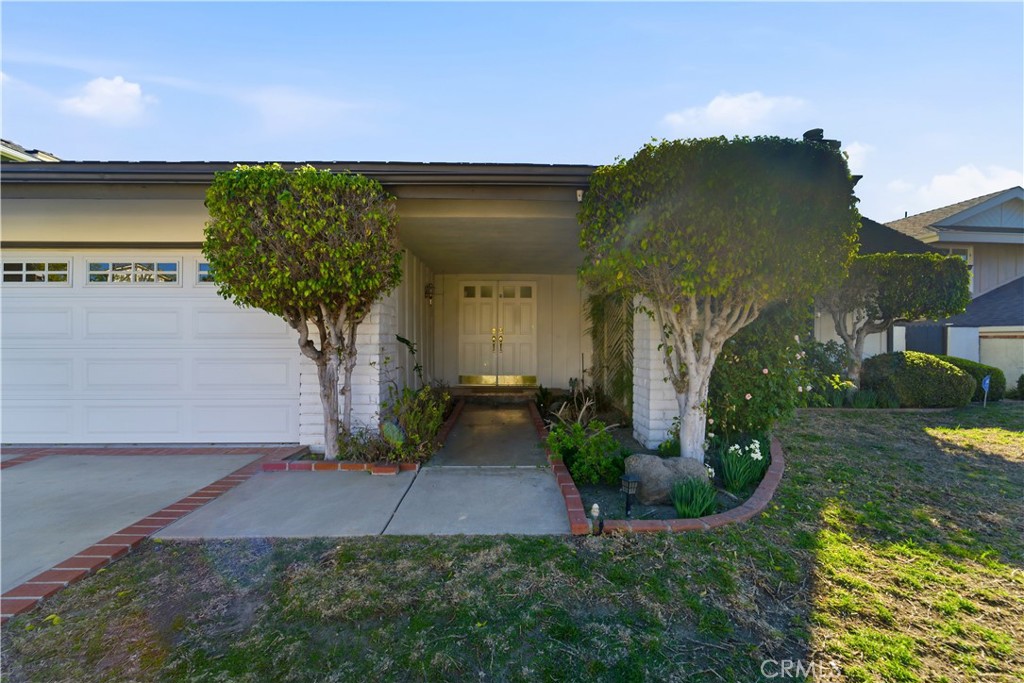 11344 Baird Avenue Porter Ranch, CA 91326 - Photo 42 of 45 a front view of a house with garden