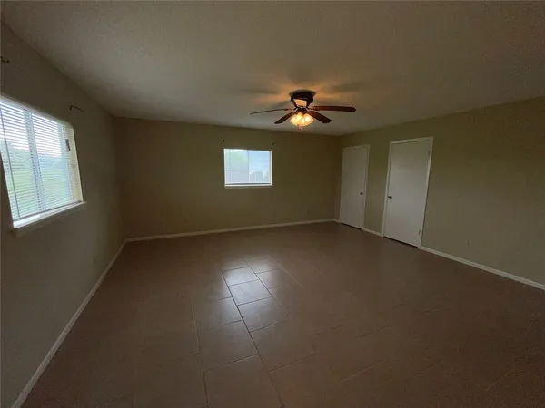 a view of empty room with windows