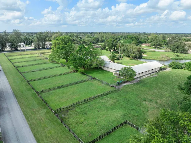 a view of a field with an trees